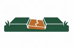 A cracked paving section lower than its surroundings